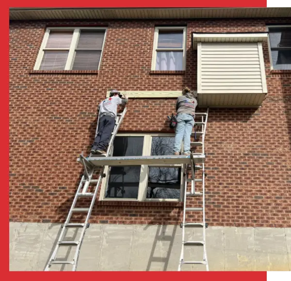 Two men are on a ladder and one is holding the window open.