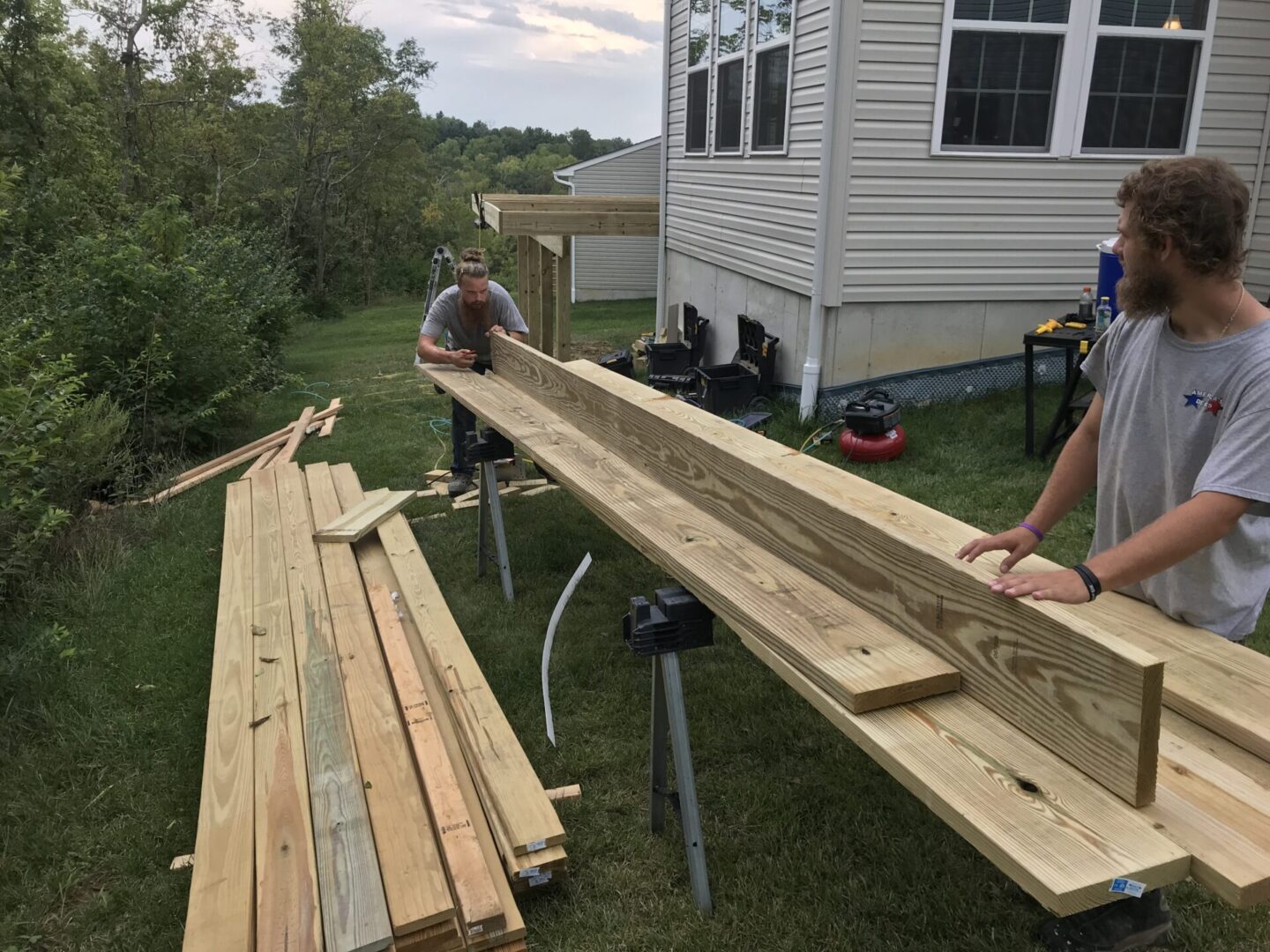 A couple of people that are building some wood